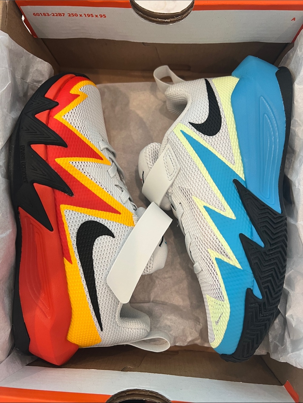 Nike Kids Dynamite Sneakers in White with Red and Blue Accents